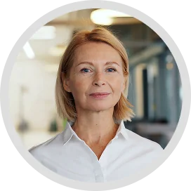 testimonials A woman with blonde hair and a white shirt, smiling and looking directly at the camera.
