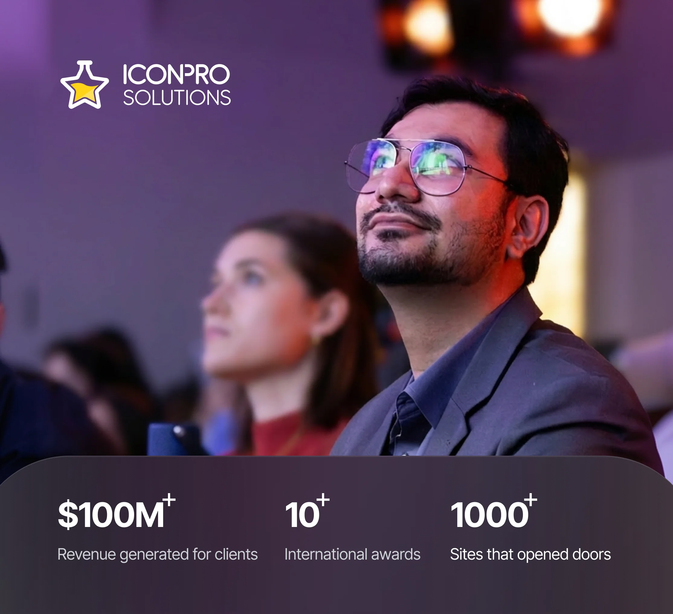 IconPro Solutions graphic: a man at an event, with $100M+ revenue for clients, 10+ international awards, 1000+ sites